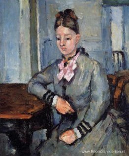 Madame Cezanne leunt op een tafel