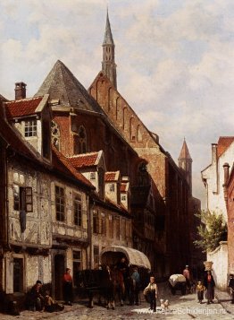 Een drukke straat in Bremen met de Sint-Johanneskerk op de achte